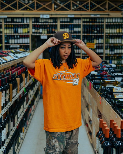 59fifty new era liquor collection hero image-model wearing los angeles dodgers fitted hat in a liquor store-los angeles dodgers