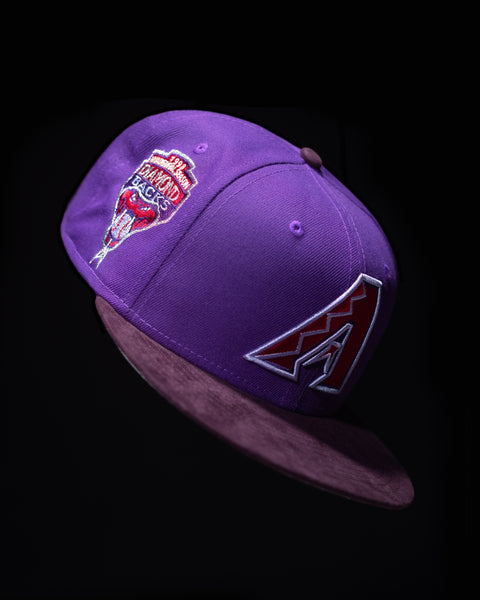 NEW ERA 5950 MONOCHROME COLLECTION HERO IMAGE-PURPLE ARIZONA DIAMONDBACKS FITTED HAT WITH RED LOGO SUSPENDED IN AIR