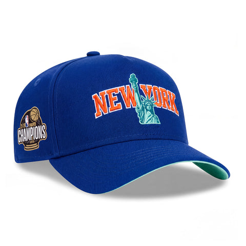Pre-Order New Era 9Forty A-Frame New York Knicks 2026 NBA Champions Patch Statue of Liberty Arch Mint UV Snapback Hat - Royal