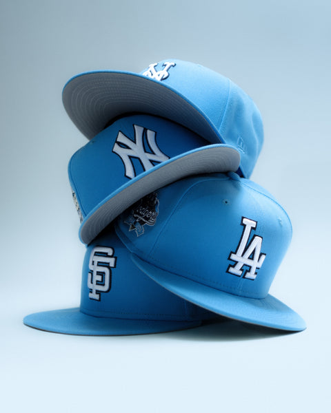 NEW ERA 5950 SKY BLUE COLLECTION HERO IMAGE-SKY BLUE FITTED HATS IN A STACK-NEW YORK METS,SAN FRANCISCO GIANTS,LOS ANGELES DODGERS,NEW YORK METS